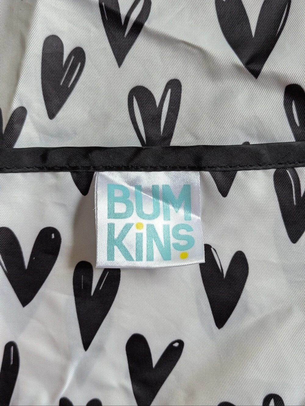 Bumkins White Bib Smock with Black Heart Print